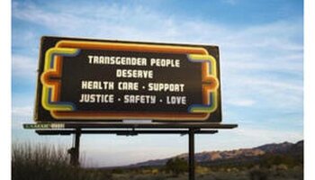 billboard that says "transgender people deserve health care support justics safety love"